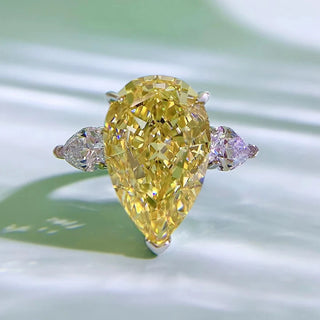 Sterling silver ring featuring a 5-carat champagne-colored pear-cut lab sapphire in a classic prong setting.