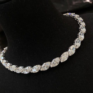 Marquise Cut Necklace featuring a lab sapphire in a marquise-shaped setting, crafted in 925 sterling silver with a delicate chain, displayed against a neutral backdrop.