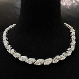 Marquise Cut Necklace featuring a lab sapphire in a marquise-shaped setting, crafted in 925 sterling silver with a delicate chain, displayed against a neutral backdrop.