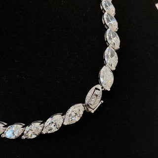 Marquise Cut Necklace featuring a lab sapphire in a marquise-shaped setting, crafted in 925 sterling silver with a delicate chain, displayed against a neutral backdrop.