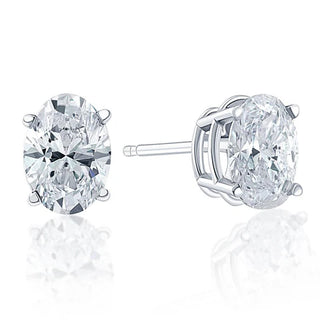 Oval cut lab grown diamond stud earrings in 18K gold (1 carat EF color, VVS clarity) for women.