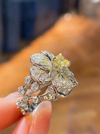 The Daffodils Ring in sterling silver with a radiant lab sapphire, floral-inspired cocktail ring for women in sculptural spring design