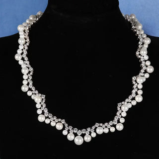 Wave of Pearls Necklace, crafted from 925 sterling silver with lustrous pearls and lab-created sapphires. A serene and elegant design inspired by the ocean, adding timeless beauty to the neckline.