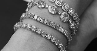 Close-up of a sparkling tennis bracelet being gently cleaned with a soft cloth, showing proper jewelry care technique.