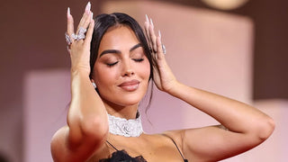 Georgina Rodríguez attending the Venice Film Festival, styled in glamorous eveningwear with diamond jewelry that includes bold statement rings and a sparkling choker necklace.