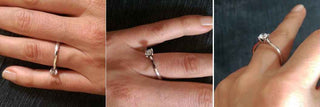 A close-up of an engagement ring spinning on a finger, illustrating the issue of ring movement.