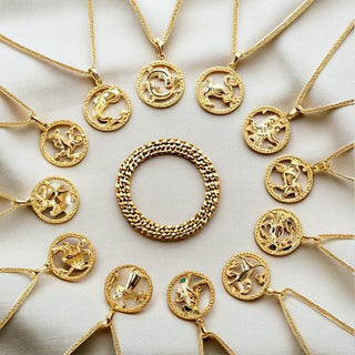 Astrology chart surrounded by zodiac-inspired jewelry and birthstones, highlighting the connection between style and the stars.