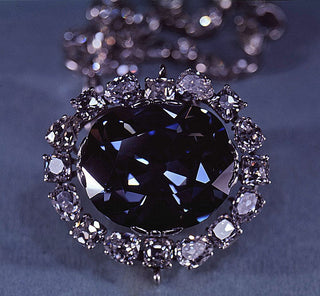 An elegant arrangement of diamonds in various colors—yellow, pink, blue, and clear—each labeled with personality traits, symbolizing the emotional and psychological meanings behind different diamond hues.
