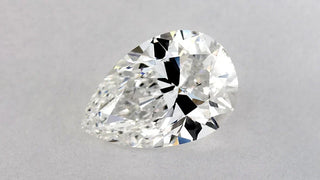 Close-up of an oval diamond showing a visible dark bow tie effect across the center