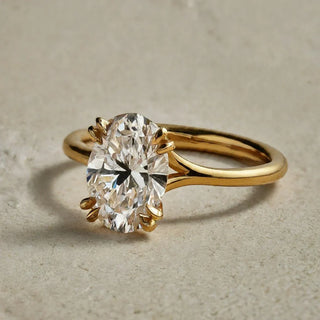 Elegant double claw prong engagement ring showcasing a brilliant-cut diamond, emphasizing secure and stylish stone setting.