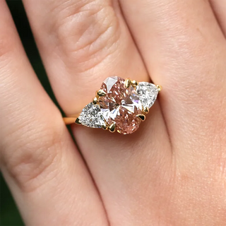 Close-up image of a custom jewelry piece featuring a mix of lab-grown diamonds and natural diamonds, highlighting their brilliance and unique design.