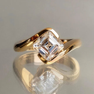 Yellow gold ring featuring a lab-grown Asscher cut diamond, showcasing clean step-cut facets and a bold, geometric silhouette