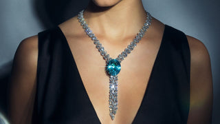  Vivid neon-blue Paraiba tourmaline gemstone with bright internal glow.