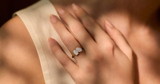 “Elegant Toi et Moi ring featuring two distinct gemstones symbolizing love and unity, set in a romantic and modern design.”