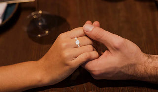 Couple browsing engagement rings together at a jewelry store