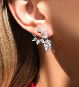 A radiant lab-grown diamond displayed on a green leaf, symbolizing sustainability and eco-friendly luxury.