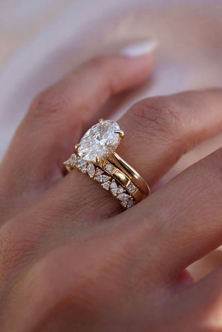 Different diamond cuts displayed side by side, including round, princess, emerald, and oval, highlighting their unique shapes and brilliance.