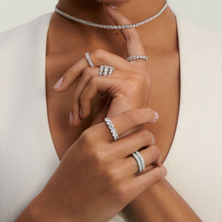 Jewelry being appraised and documented for insurance with a loupe and valuation tools.