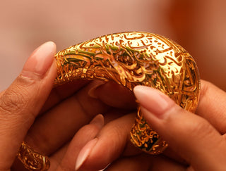 A handcrafted custom ring being designed on a jeweler’s workbench, showcasing the artistry and uniqueness of bespoke jewelry.