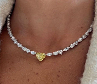 A woman wearing minimalist gold jewelry in a daytime office setting, transitioning to a glamorous evening look with the same accessories.