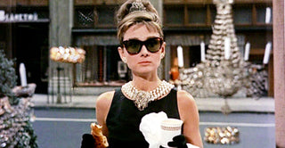 A timeline display of iconic jewelry styles from the 1920s to the present, showcasing changing fashion trends by decade.