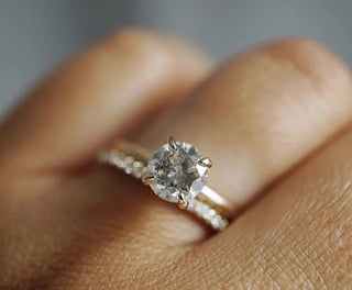 Close-up of a wedding ring with a missing or broken diamond, symbolizing damage and offering reassurance for repair or replacement solutions.