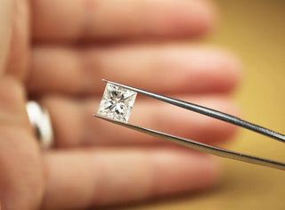 Side-by-side comparison of a round-cut diamond and a princess-cut diamond on a white background.