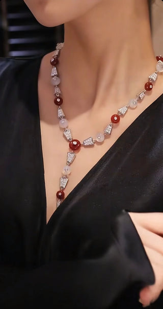 Crimson Bind Necklace for women, made from 925 sterling silver with platinum plating and a red lab-created sapphire. Elegant Y-shaped design with a modern twist.