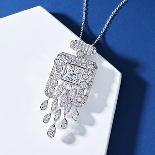 Crystal Cascade Pendant Necklace with lab sapphire and side stones, set in 925 sterling silver, capturing cascading elegance.
