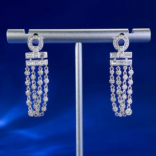 Frostlight Drop Earrings: 925 sterling silver drop earrings for women set with shimmering lab-created sapphire stones.