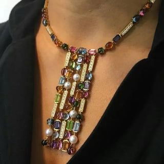 Glintfall Necklace with five-layer tassel drop design, crafted from 925 sterling silver and adorned with lab-created sapphires. A shimmering, elegant necklace that captures light and movement.