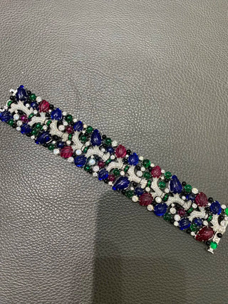 Twilight Flora silver cuff bracelet with floral design and lab sapphires – bold wrist cuff inspired by nature and twilight beauty.