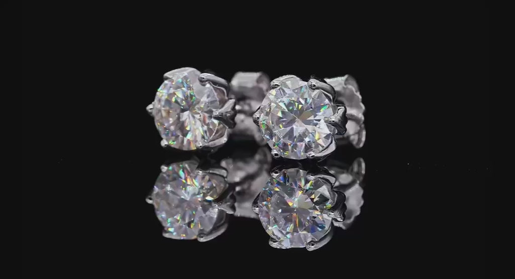 Lotus Dew Studs in sterling silver with lab-created sapphires, offering a delicate sparkle and timeless elegance.