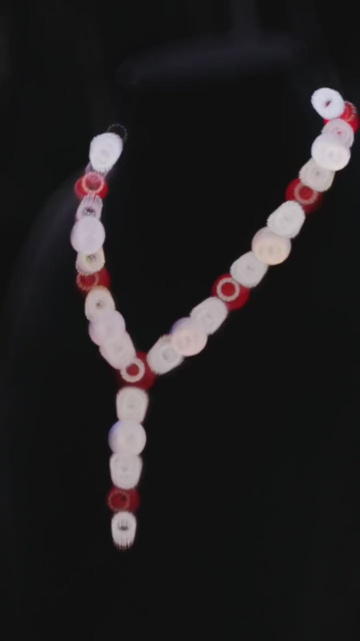 Crimson Bind Necklace for women, made from 925 sterling silver with platinum plating and a red lab-created sapphire. Elegant Y-shaped design with a modern twist.